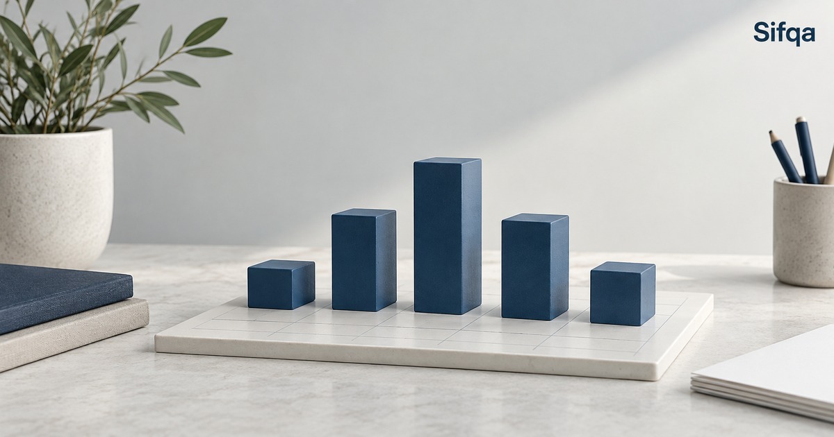Blue rectangular blocks of different heights arranged like a bar chart on a pale board.